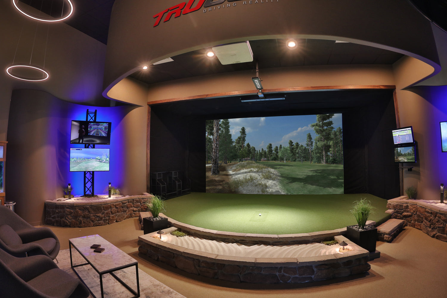 A fisheye camera lens shot of a golf simulator at TruGolf